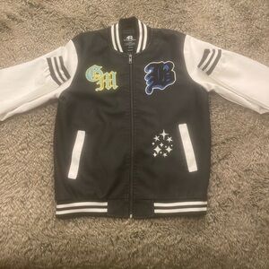 black and white brand new varsity jacket. size M